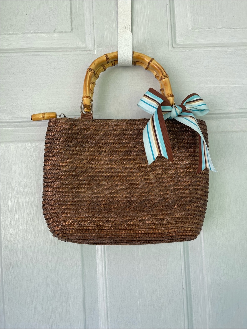 Woven Brown Straw Tote with Bamboo Handles and Blue Stripe Bow